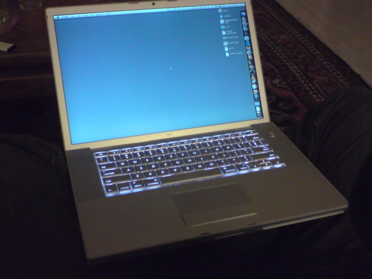a laptop computer sitting on top of a table