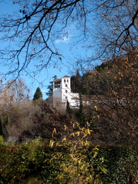 a house that looks to be built on the top of a hill