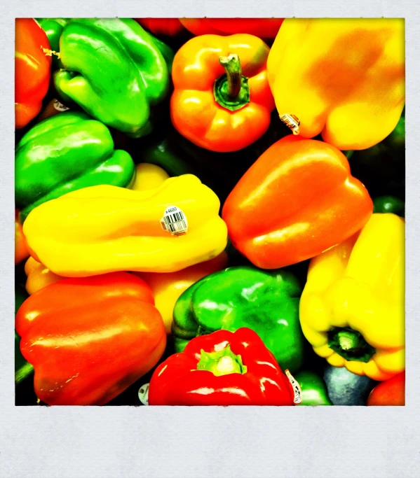 a box with a group of colorful bell peppers