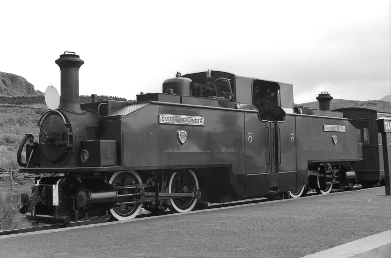 a steam train that is sitting in the railroad