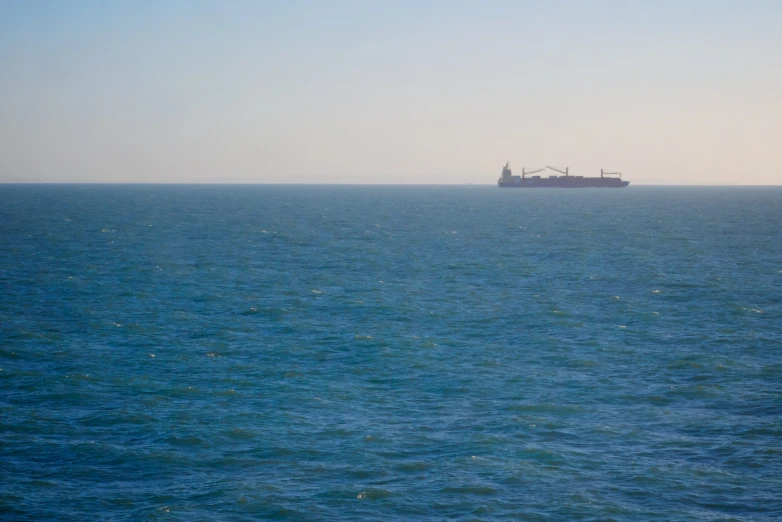 a ship on the water off shore