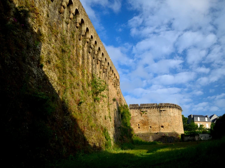 an old castle like structure with many trees near it