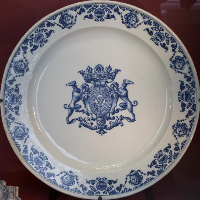 a big fancy blue plate with lions on it