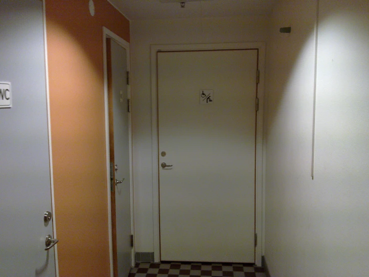 this is a hallway with a small door