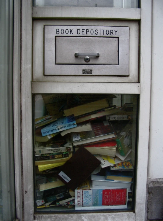 an old drawer that has books in it