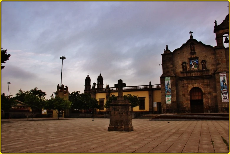 a large building is shown under a cloudy sky