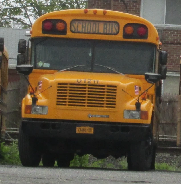 a yellow school bus parked on the side of the street