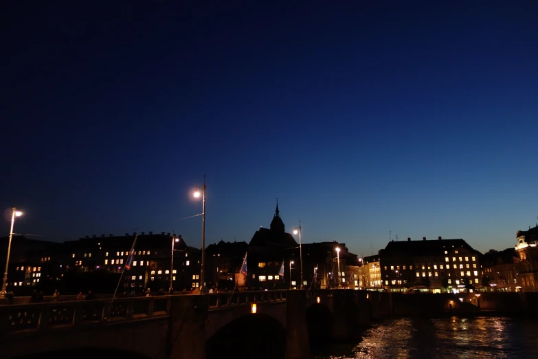 a beautiful city skyline by a bridge at night