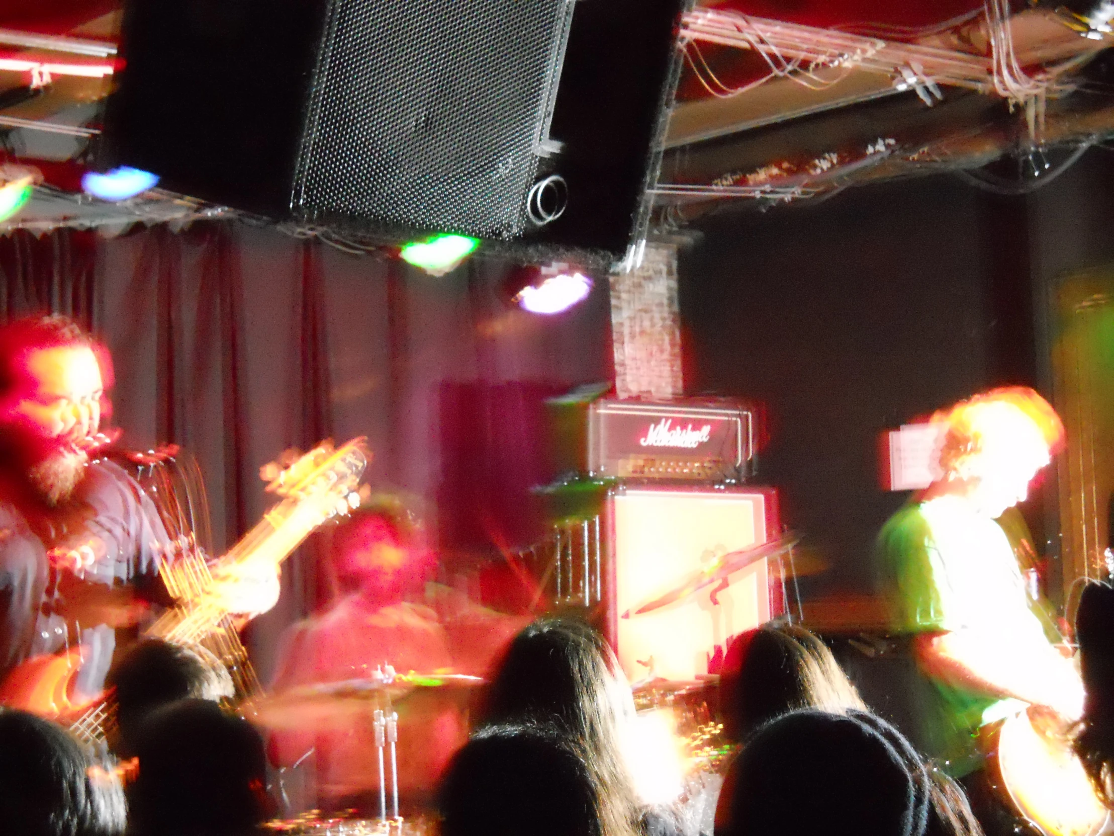 a group of people on stage with instruments