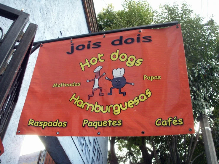 the sign outside of a restaurant called joses dos  dogs