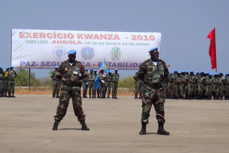 a group of people in camouflage with flags