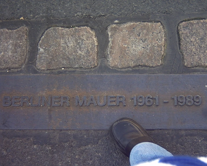 a picture of some concrete and a person's feet