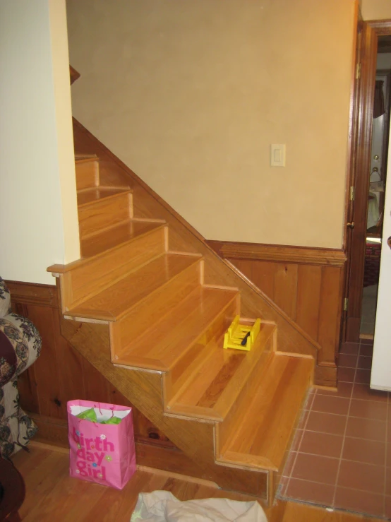 a set of stairs with a bag next to it