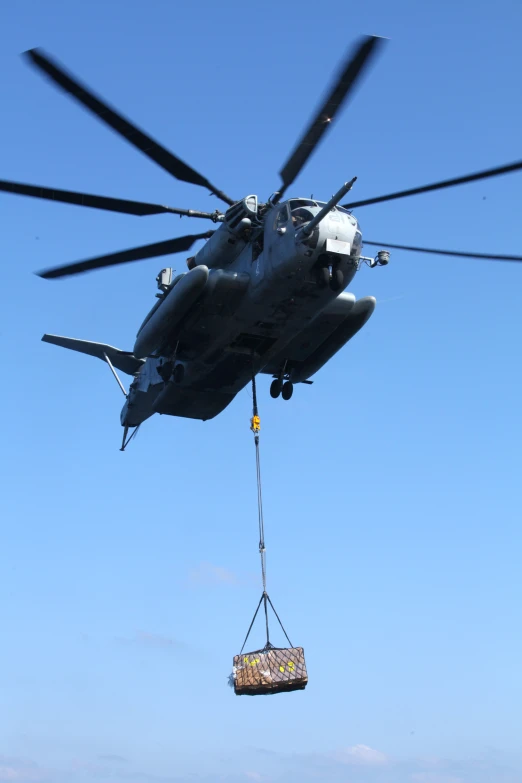 a person being hoisted by an army helicopter