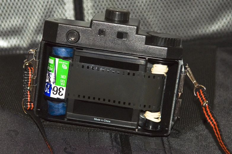 a camera with the electronic gadget attached to it