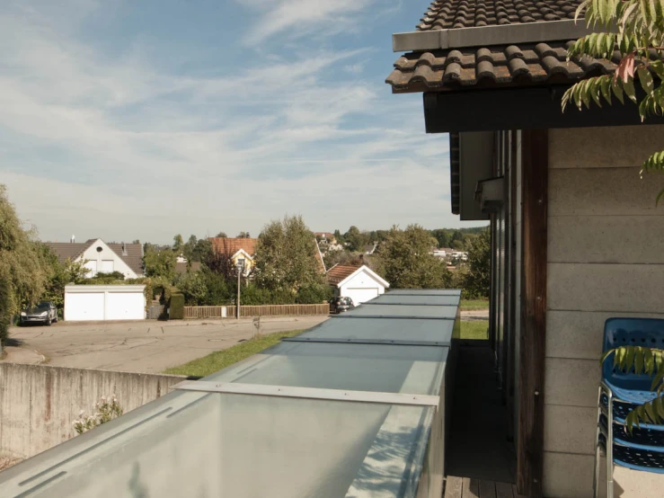 a long glass gutter with the sky in the background