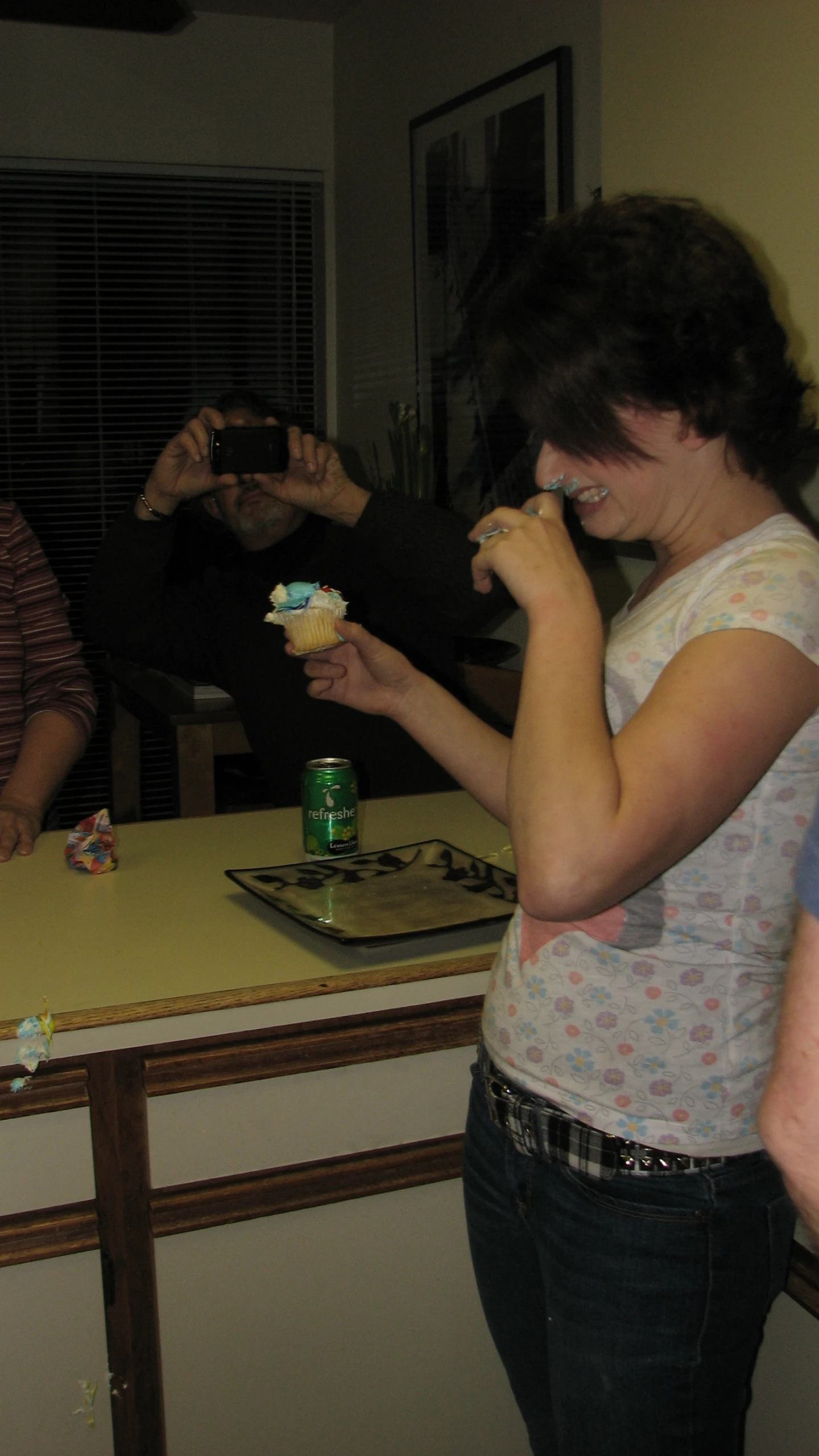 two women are eating cake at the counter