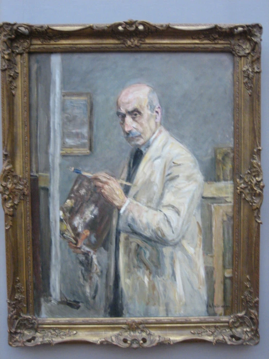 a man wearing a white suit is painting