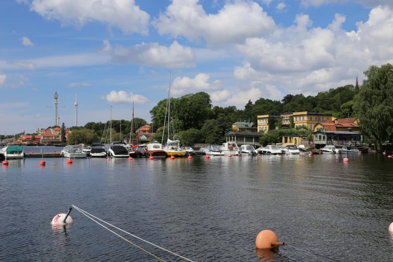 boats parked in the harbor of a lake