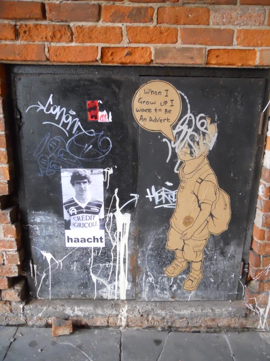 a man walking past graffiti on the side of a brick building