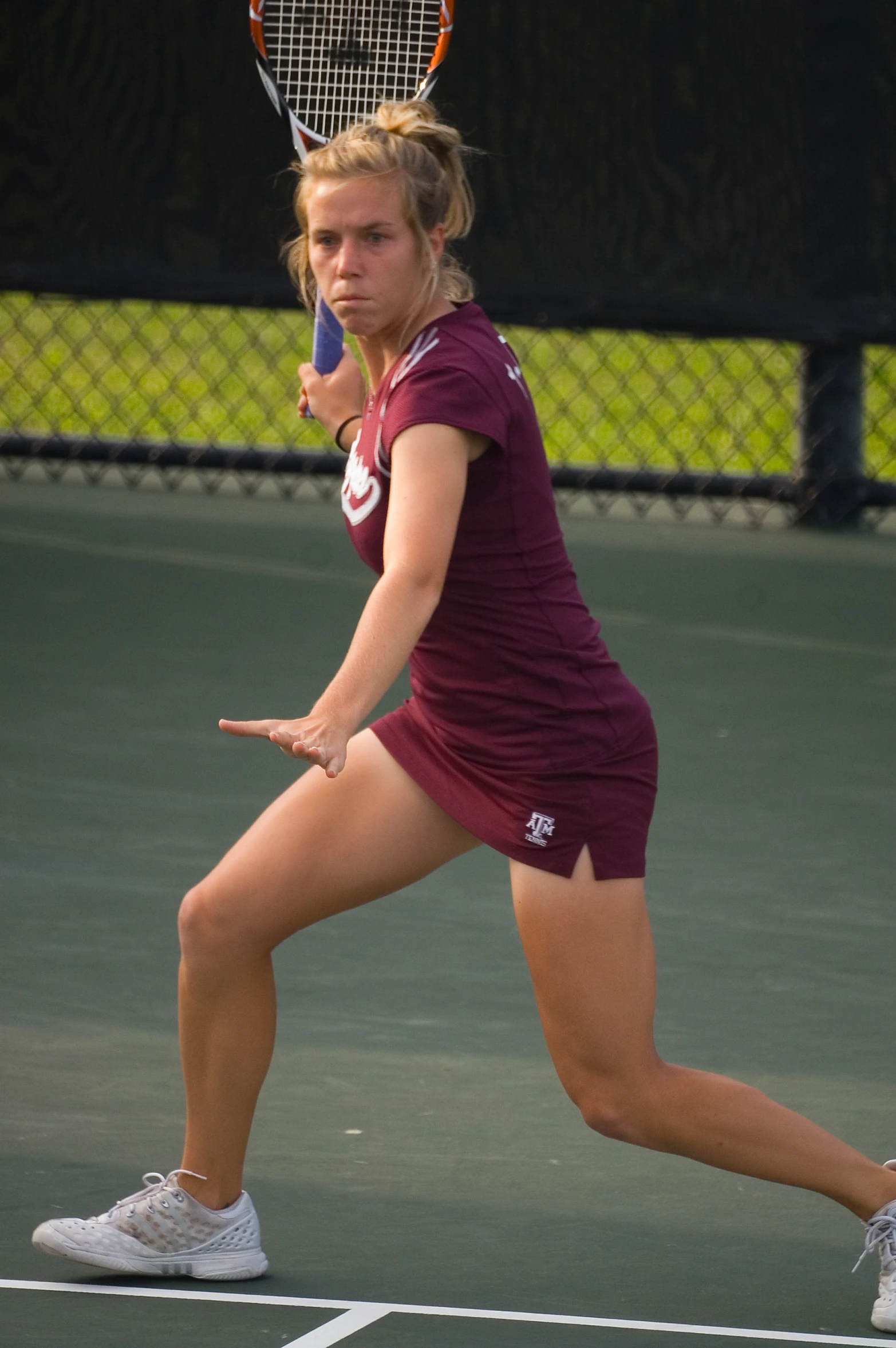 the woman tennis player is going to hit the ball