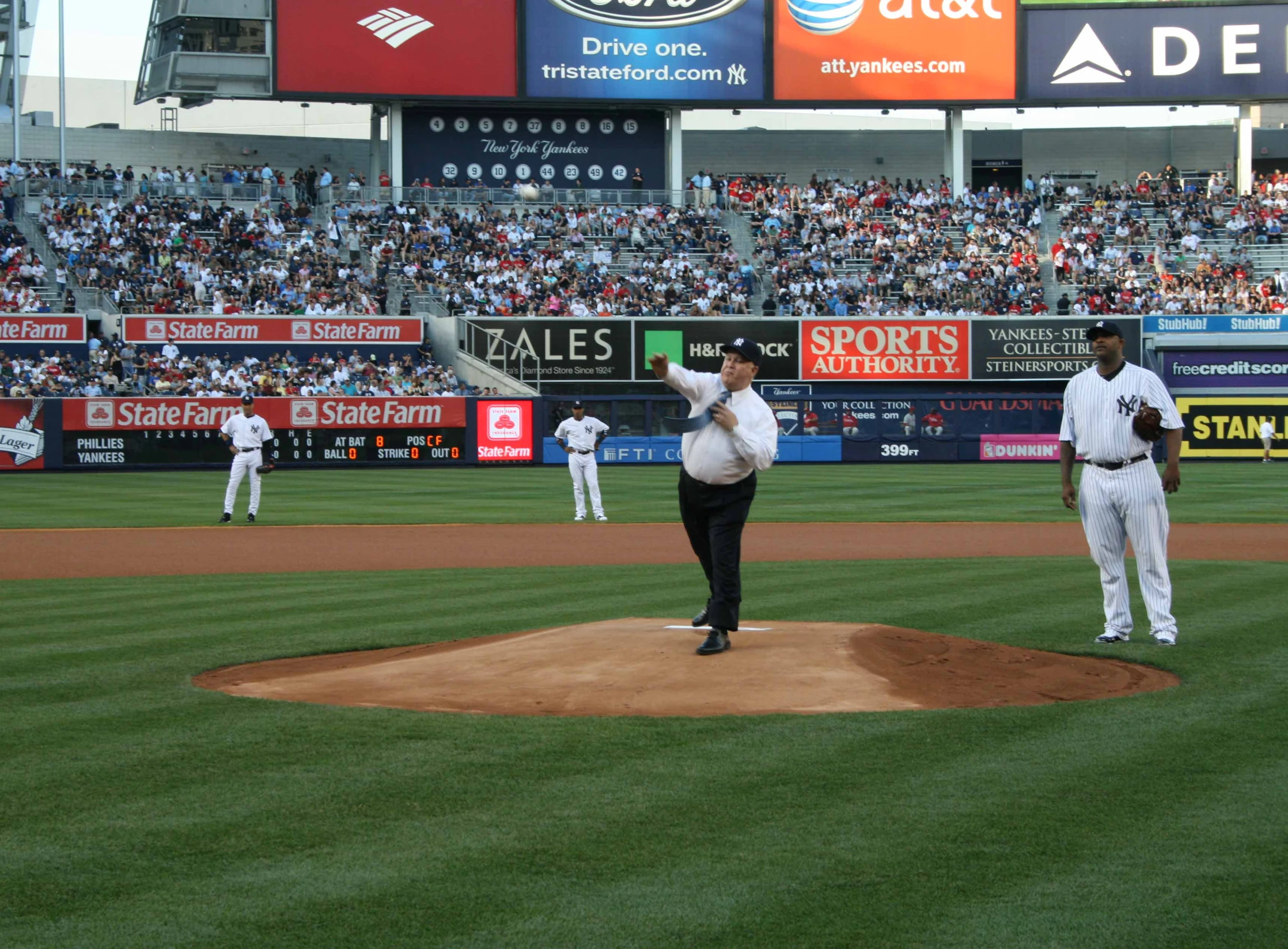 a man throwing a baseball during a baseball game