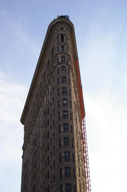 the top of a tall building under a blue sky