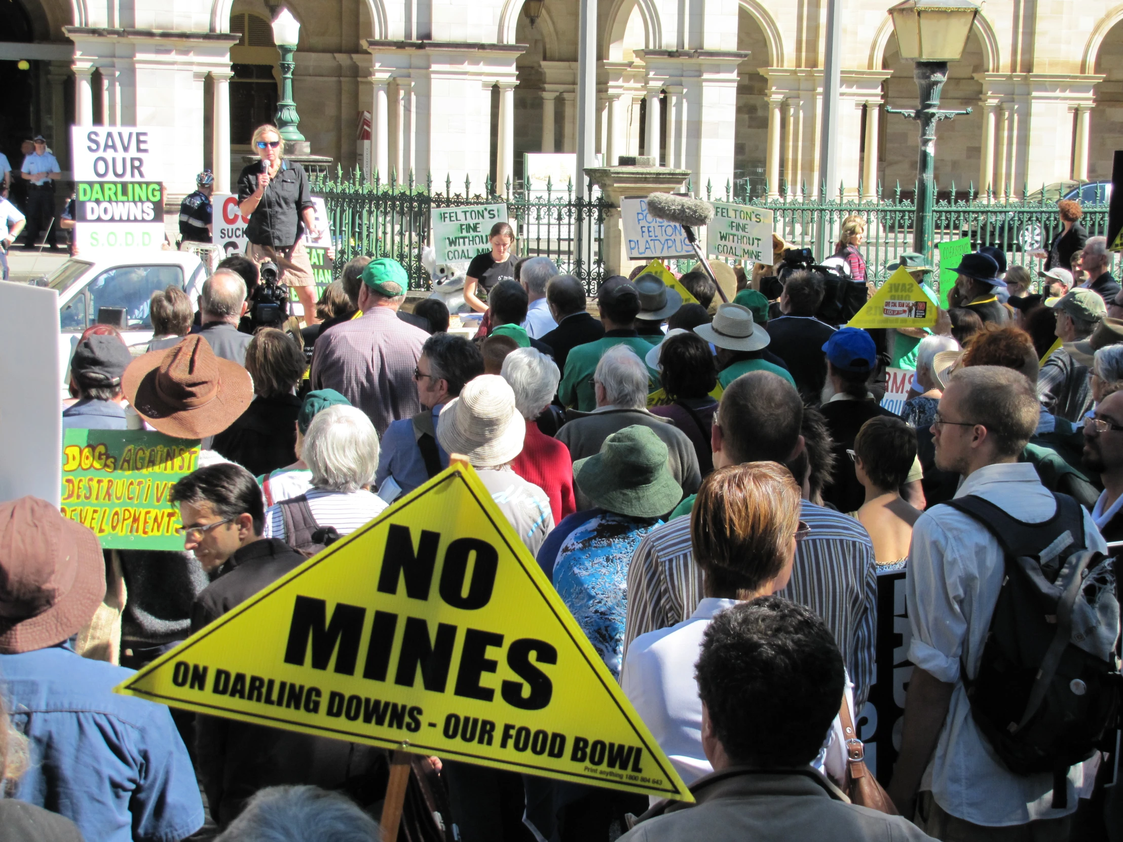 a man speaking into a crowd of people