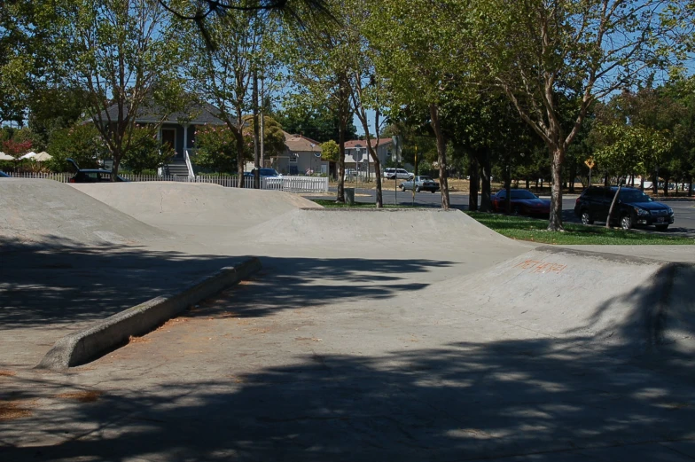 a person is on a skate board near some trees