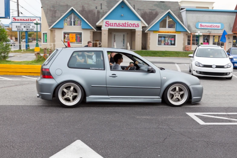 a small car parked in the parking lot