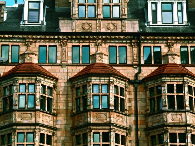 an old building has dormer windows and a clock