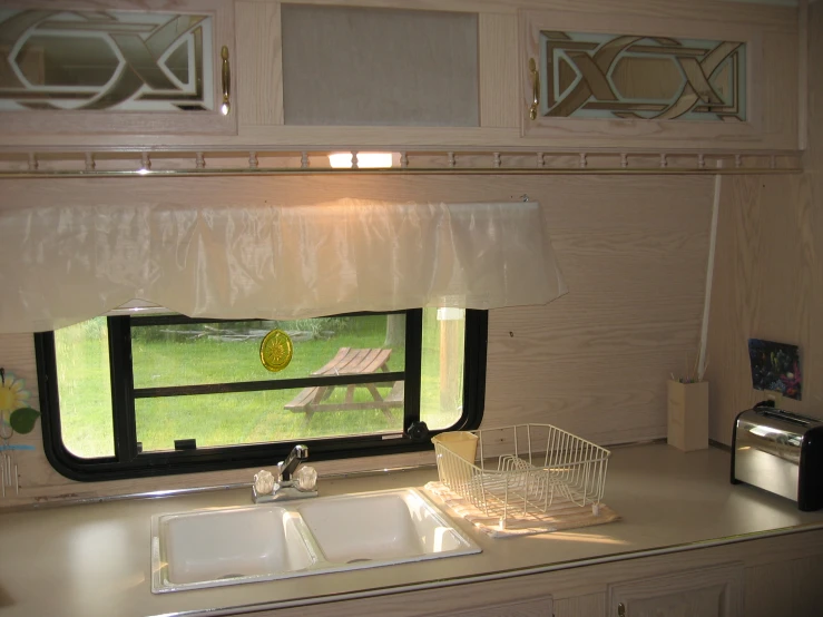 a kitchen with a window that is open