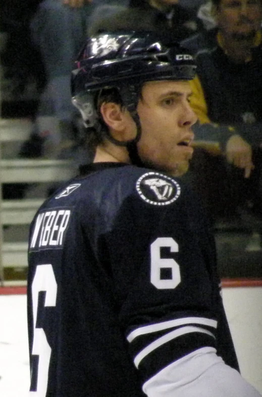 a hockey player with his jersey down and the number 6
