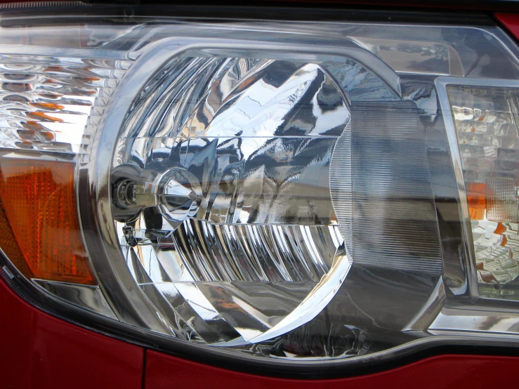 a shiny headlight is shown on the front end