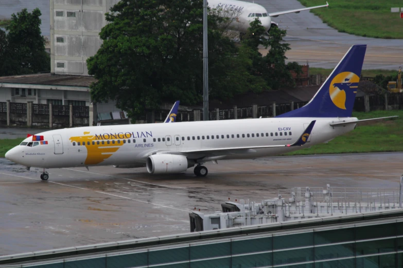 a large jetliner sitting on top of an airport tarmac