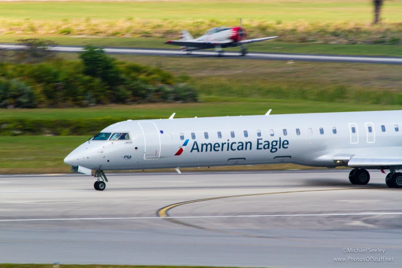 an american eagle plane is taking off from the runway