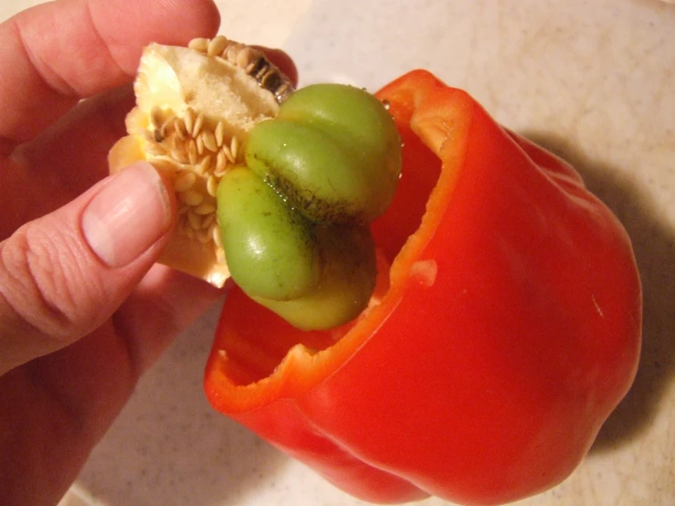 a stuffed  pepper with olives and peanut er