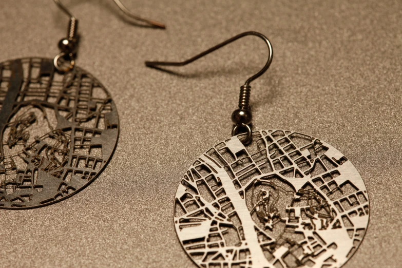 a pair of earrings sitting on top of a counter