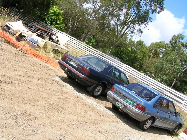 two cars that are parked next to each other