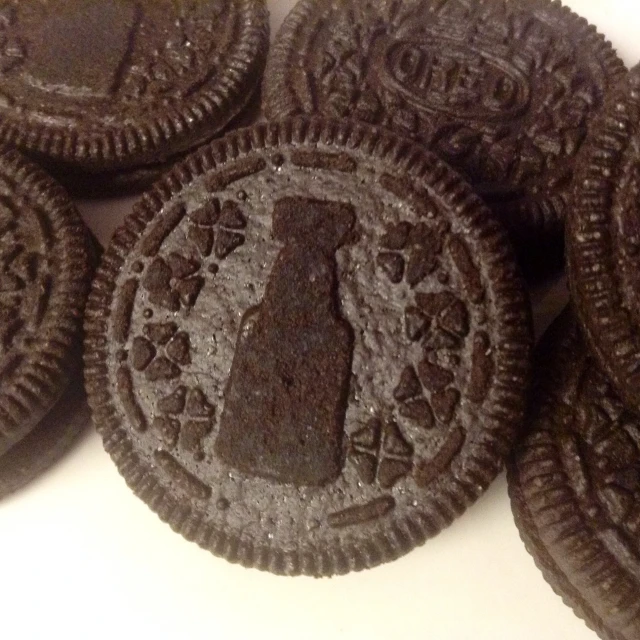 an oreo - covered cookie with a piece of chocolate on it