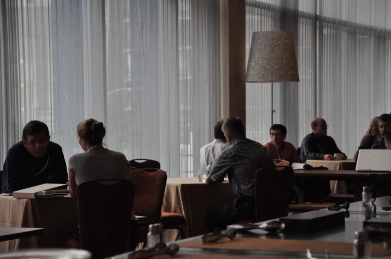 a group of people are at a table