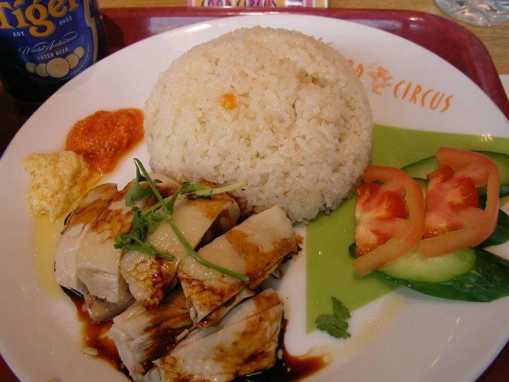 rice and food items on plate with drink