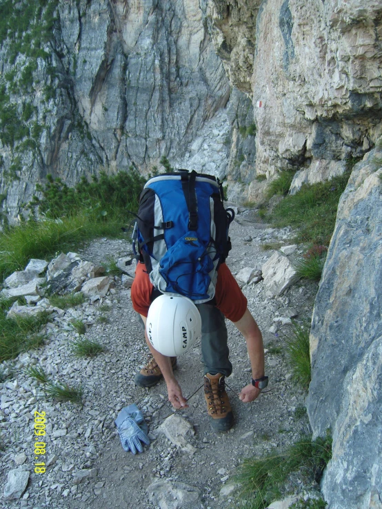 a man who is climbing up some mountains