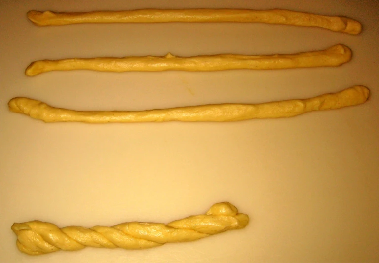 three different types of bread twists are next to each other