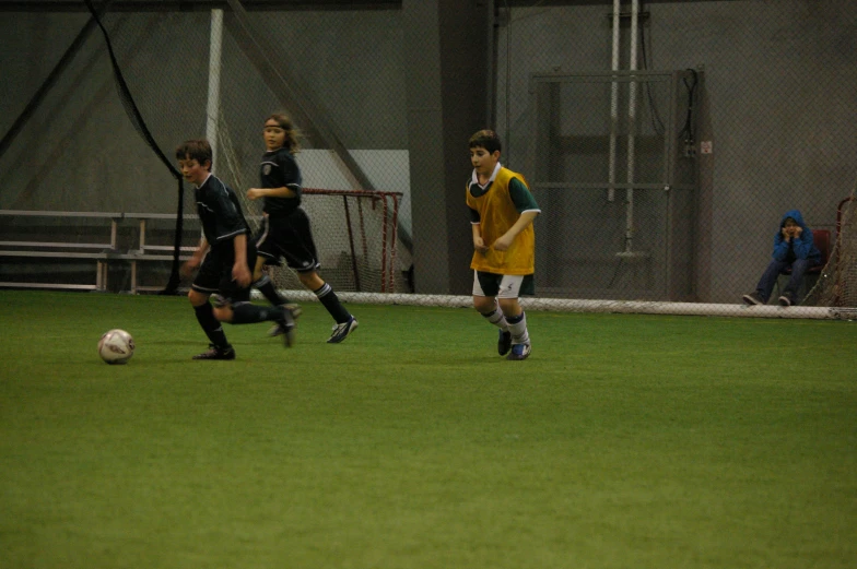 two teams of s playing soccer on a field