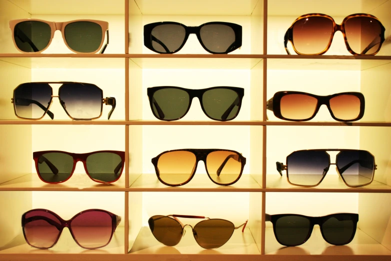 an assortment of different shades and sizes of sunglasses