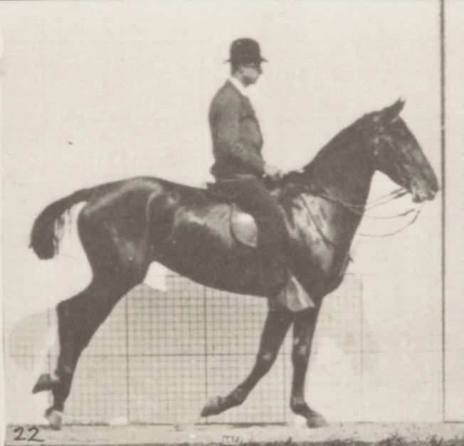 an old picture of a man riding on a horse