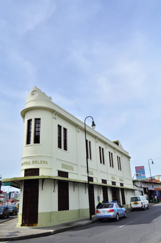 this is a building on the corner of an empty street