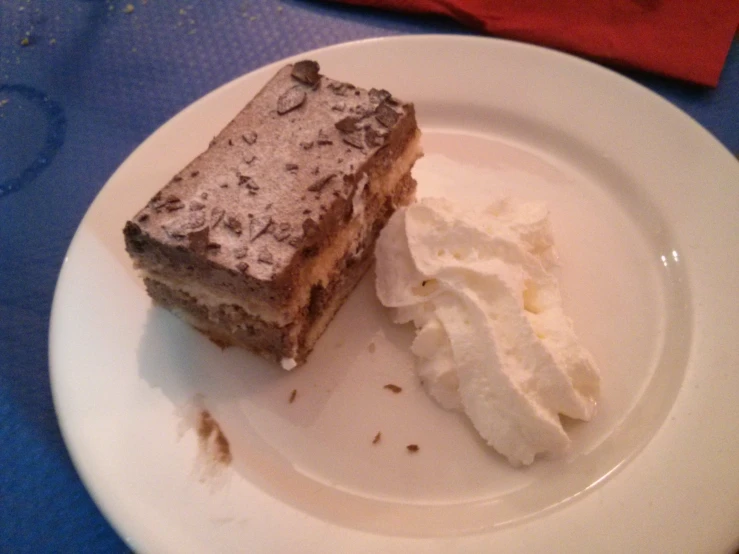 a piece of cake sitting on top of a white plate