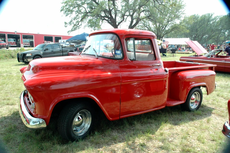 there are two trucks at the show, one older and the other newer